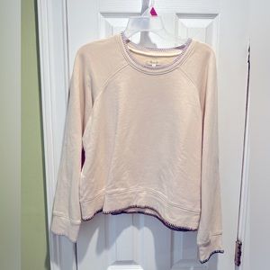 Madewell shrunken sweatshirt in cream with mixed color stitching.